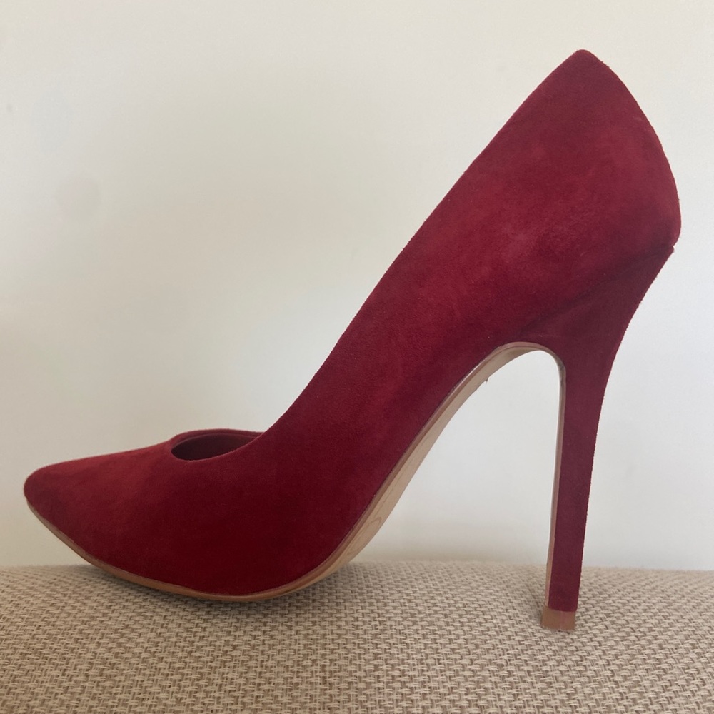 Red suede stiletto pumps
